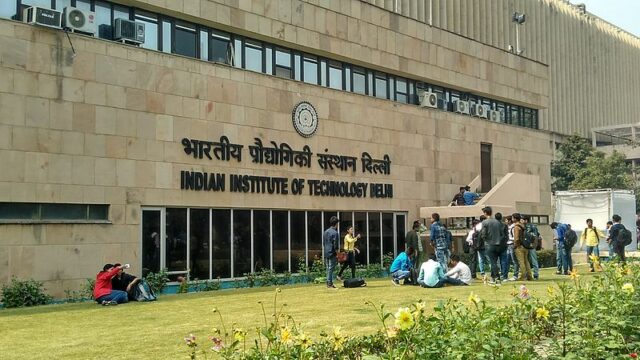 IIT Delhi building with students in the front