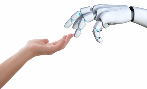 Robotic hand reaching out to human hand in white background